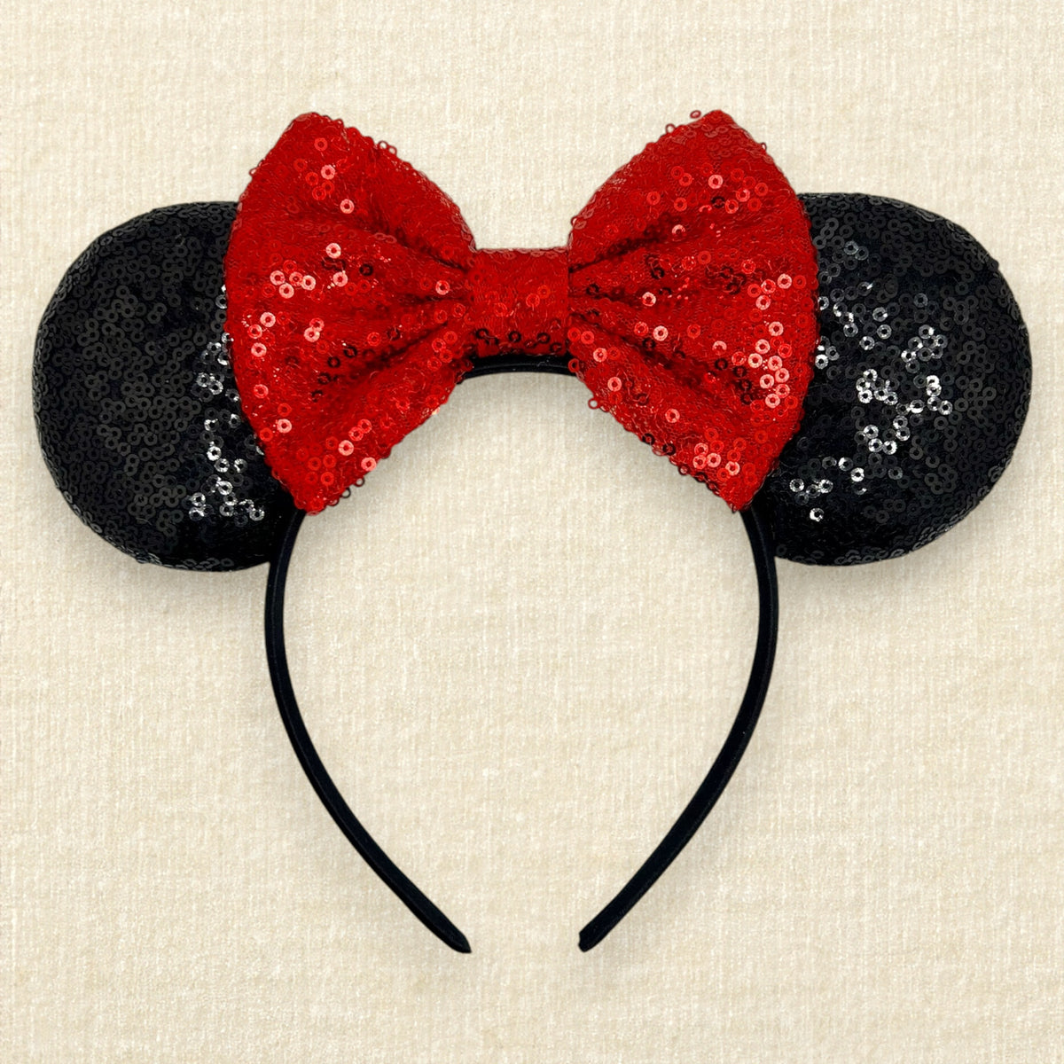 Black sequin mouse ears with red sequin bow
