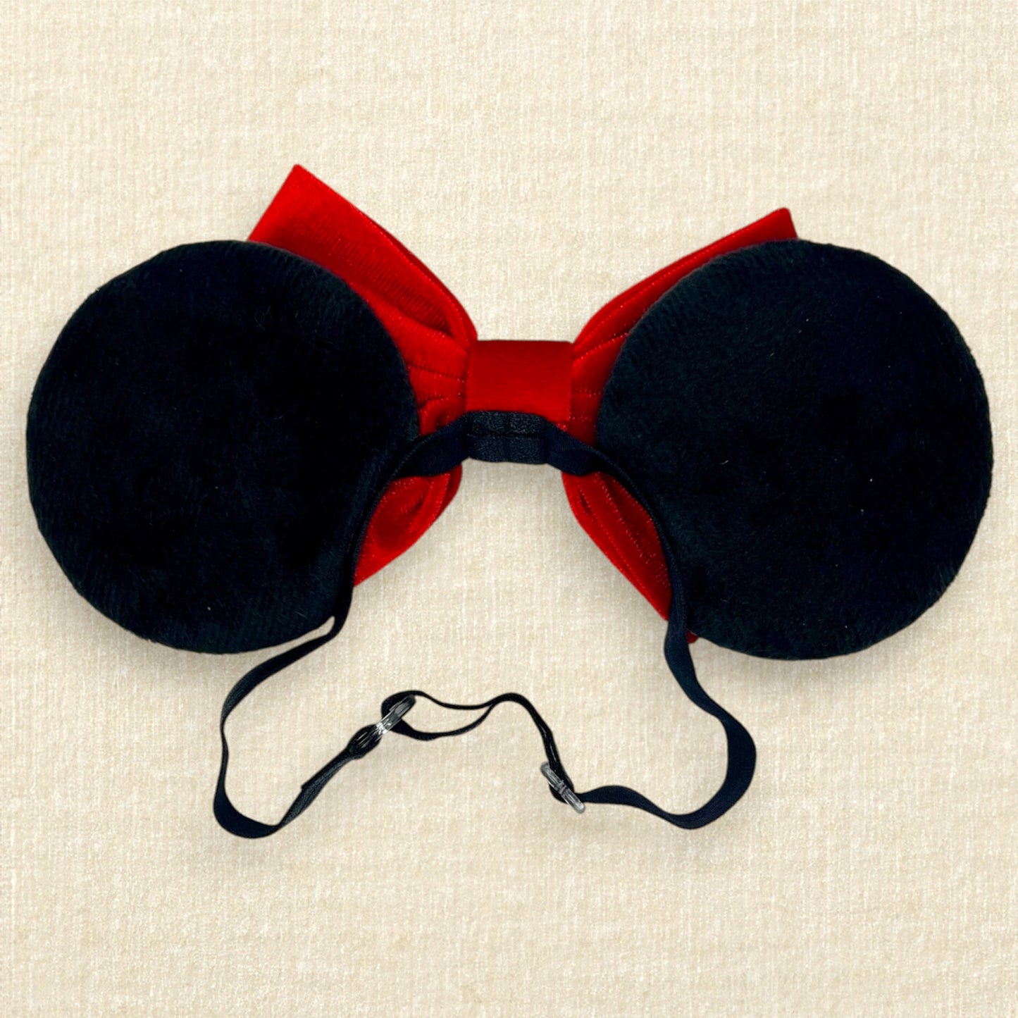 Black velvet mouse ears with red velvet bow on an elastic headband (back view)