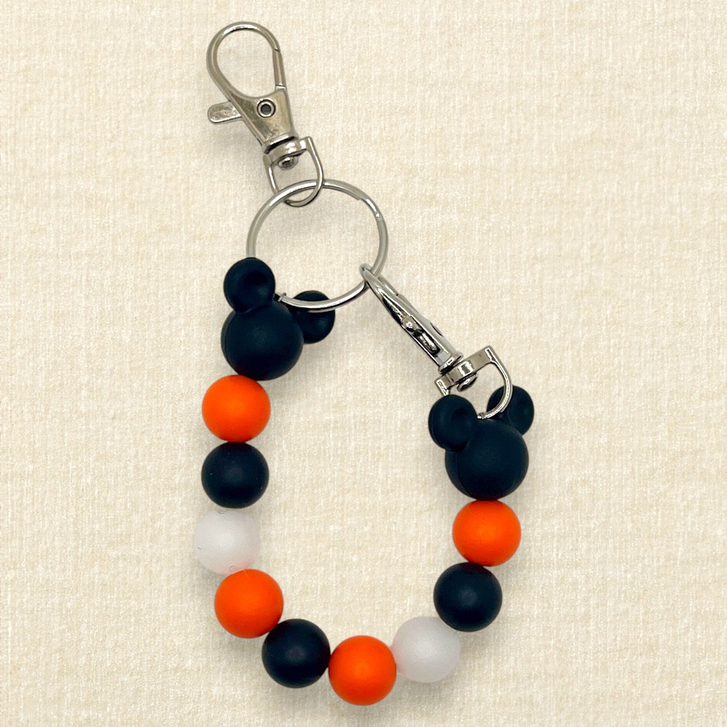 Orange and black beaded mouse ears holder keychain