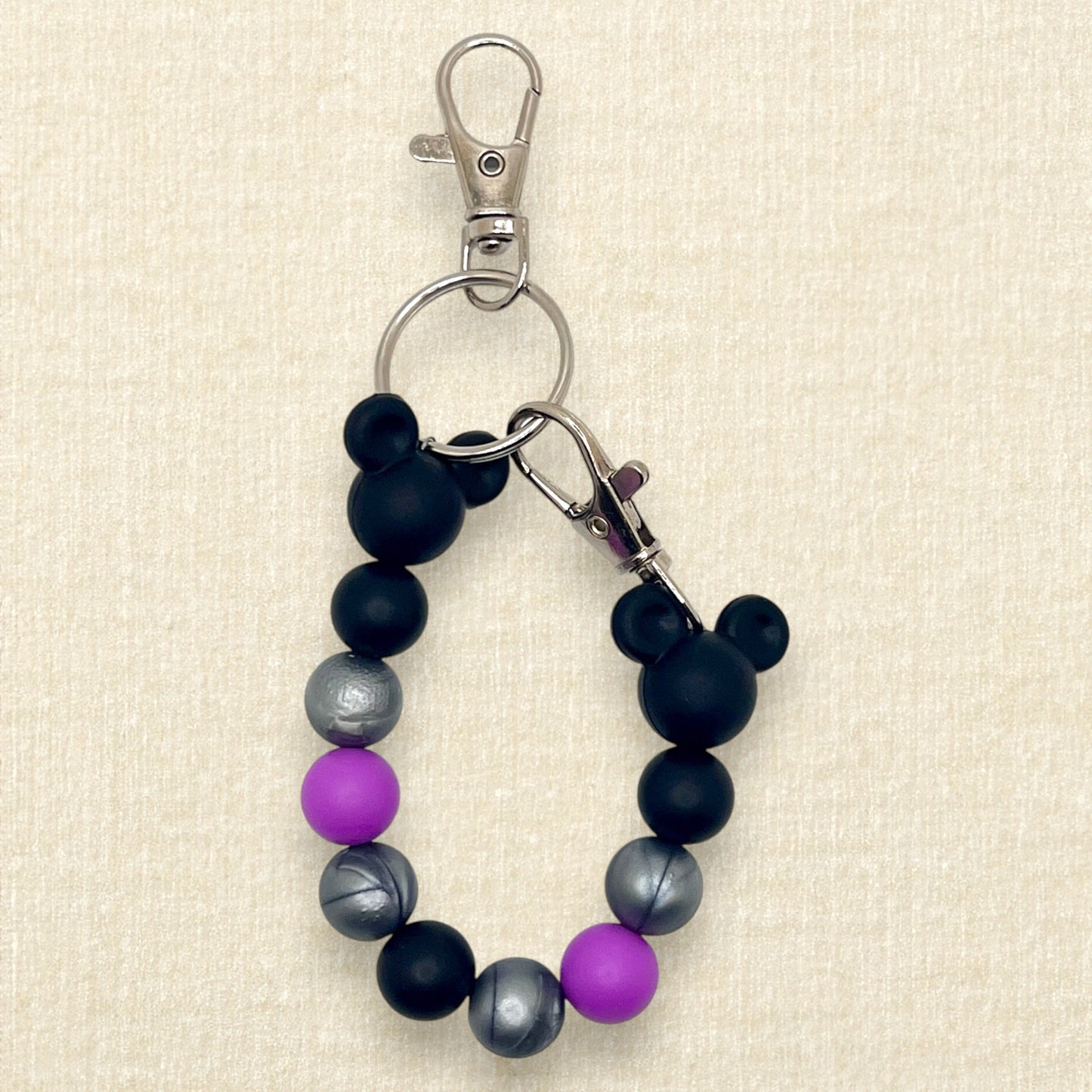 Purple, black, and silver beaded mouse ears holder keychain