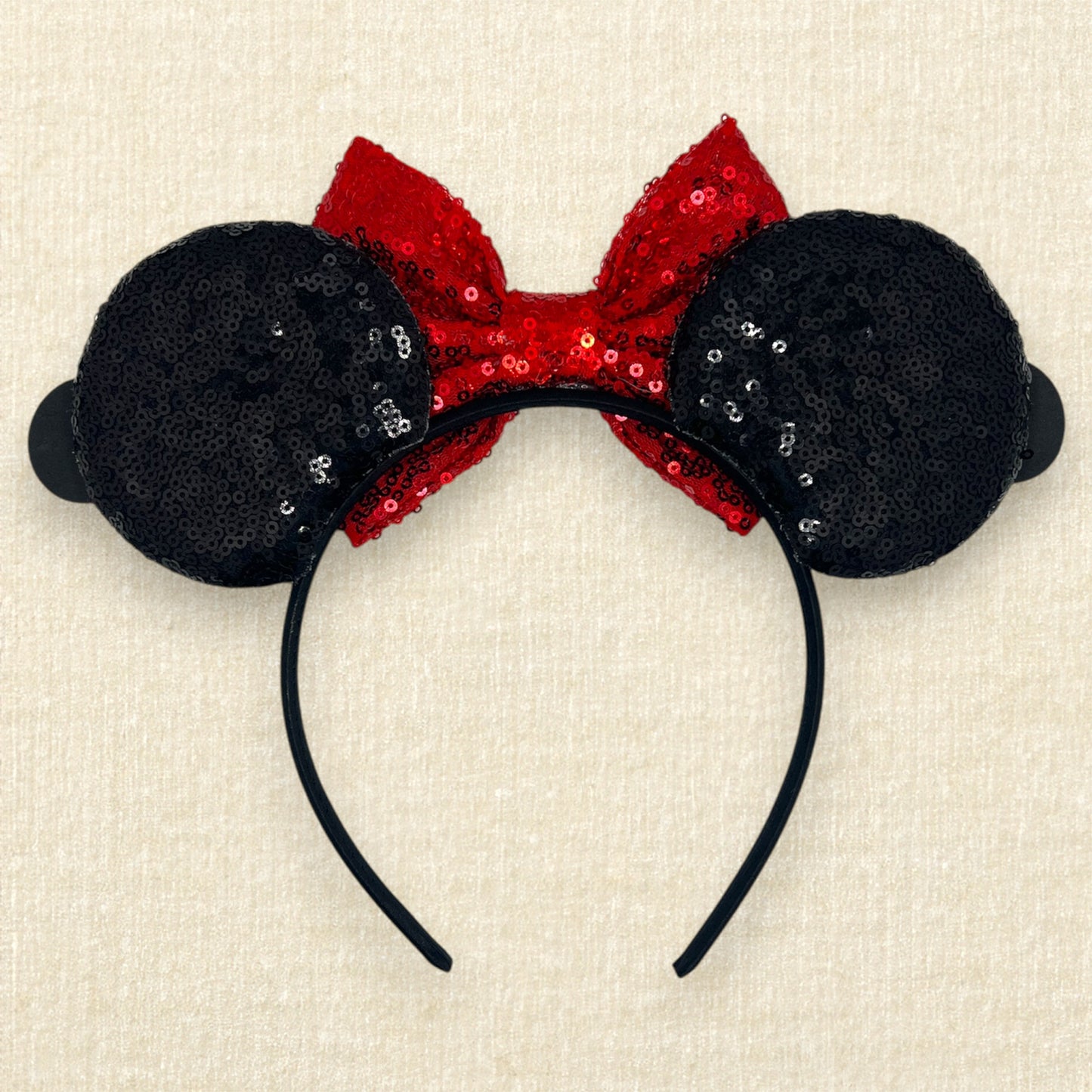 Black sequin mouse ears headband with red sequin bow and glitter mouse characters (back view)