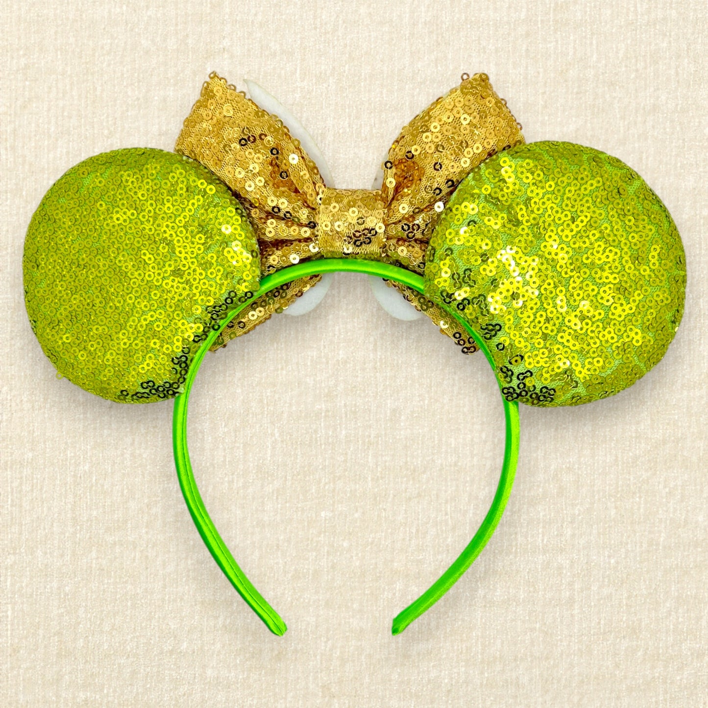 Light green sequin mouse ears headband with gold bow, glitter fairy wings, and pom-pom centerpiece (back view)
