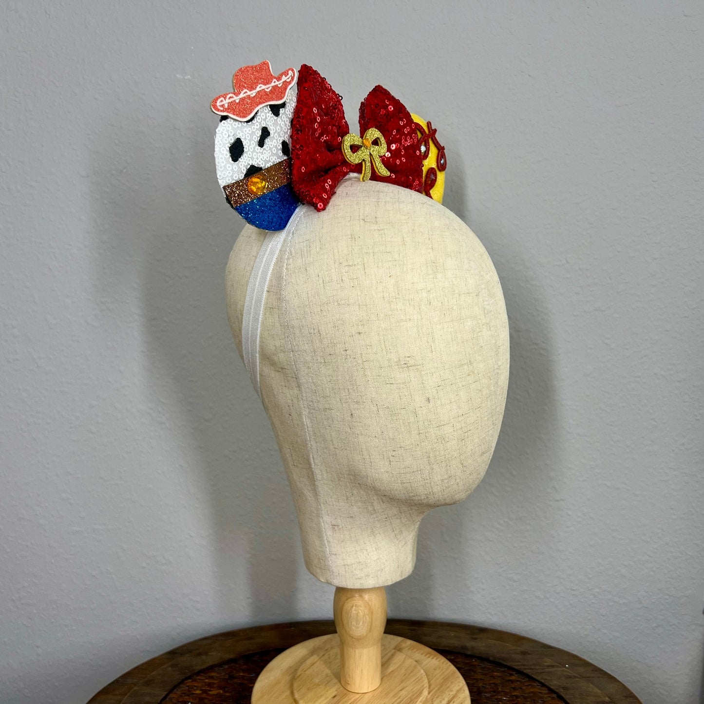 Colorful mouse ears headband with cowboy details on mannequin head