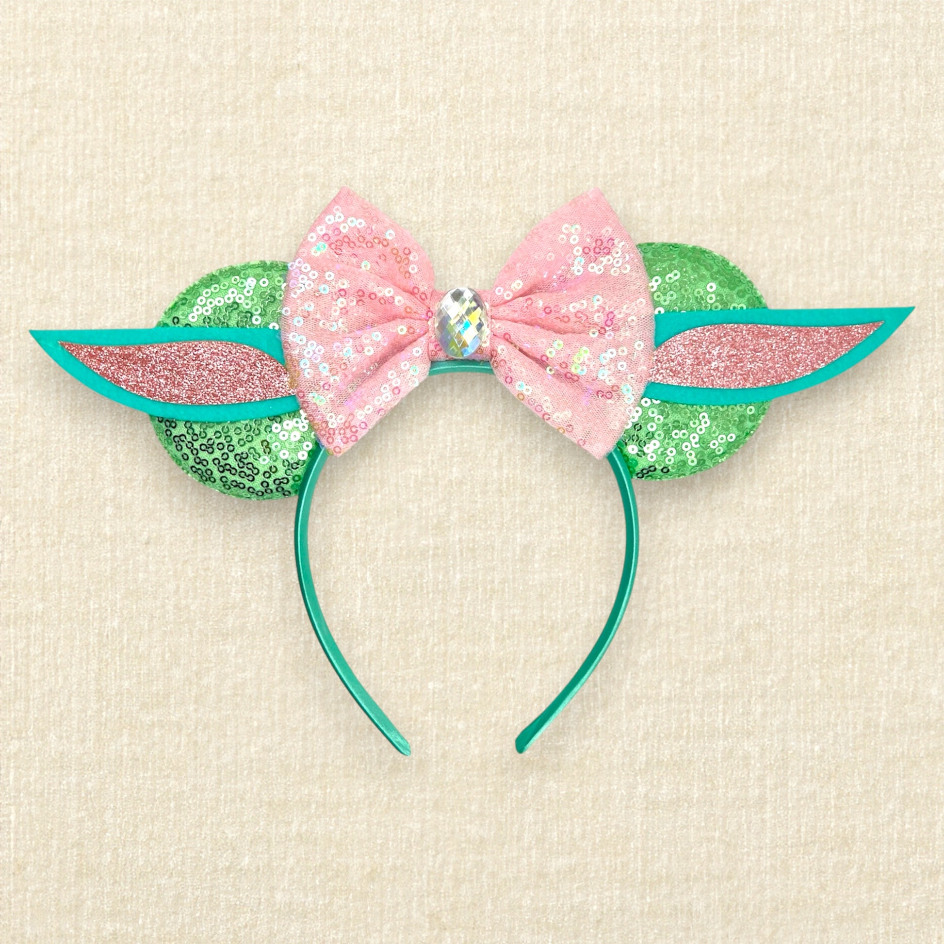 Light green sequin mouse ears headband with pink sequin bow and green and pink alien ears