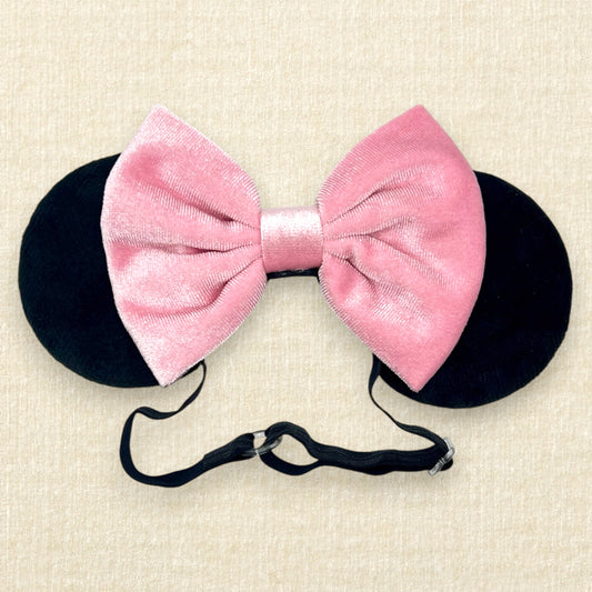 Black velvet mouse ears with pink velvet bow on an elastic headband