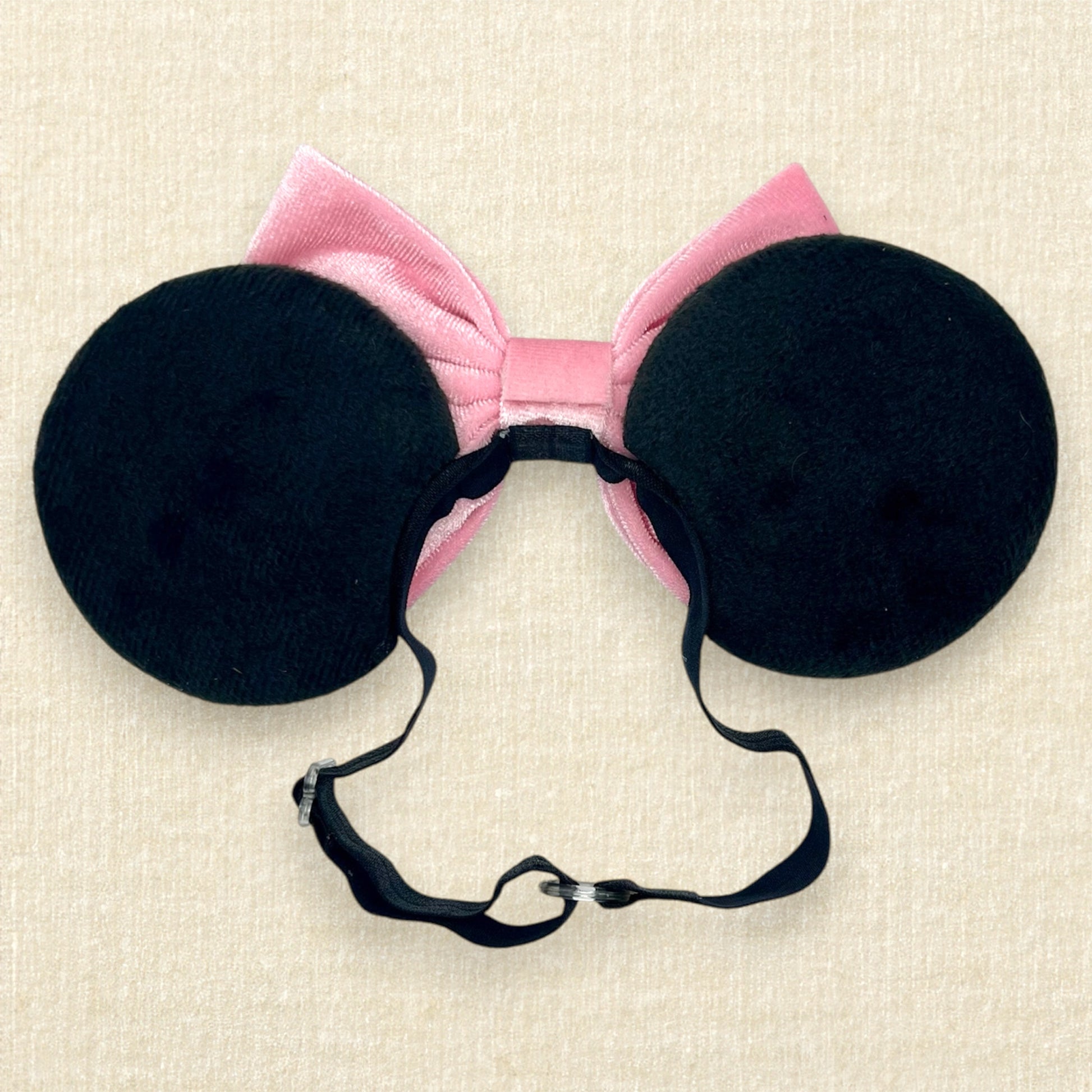 Black velvet mouse ears with pink velvet bow on an elastic headband (back view)