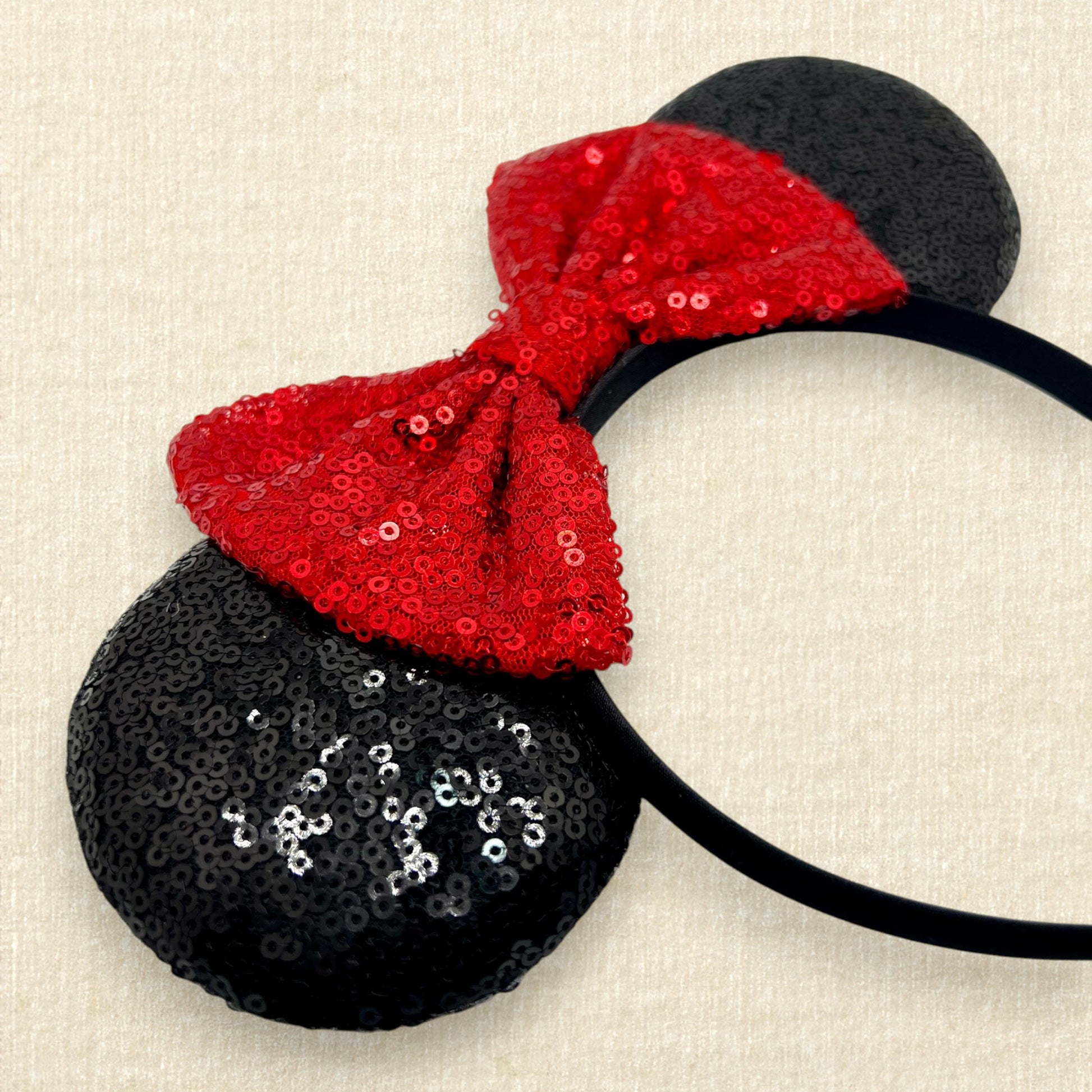 Black sequin mouse ears with red sequin bow