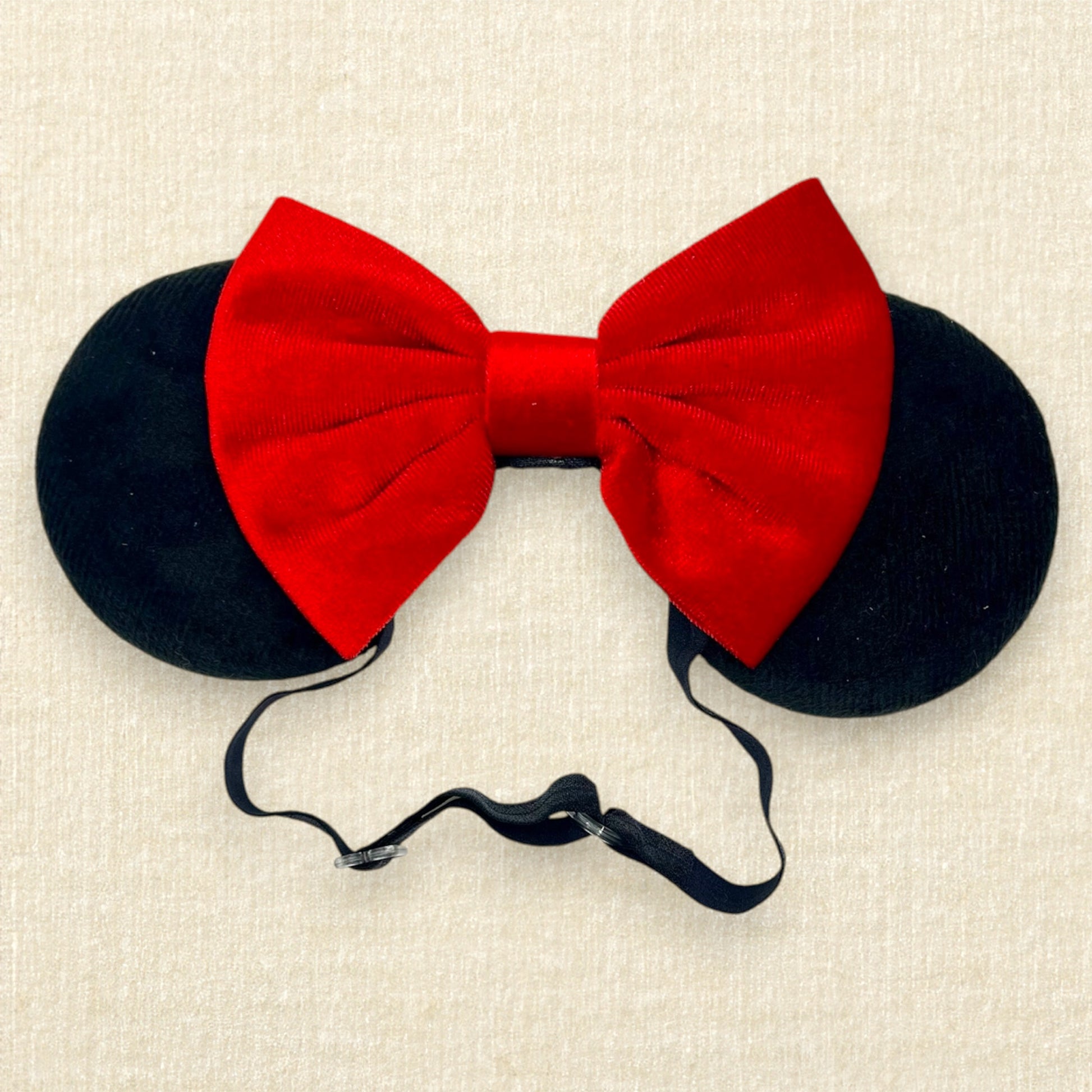 Black velvet mouse ears with red velvet bow on an elastic headband