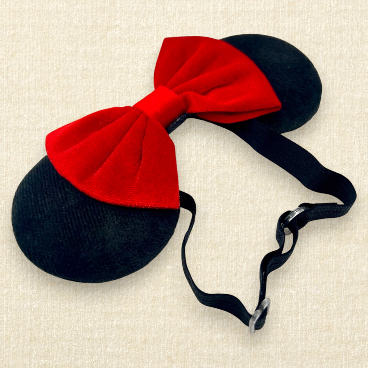 Black velvet mouse ears with red velvet bow on an elastic headband