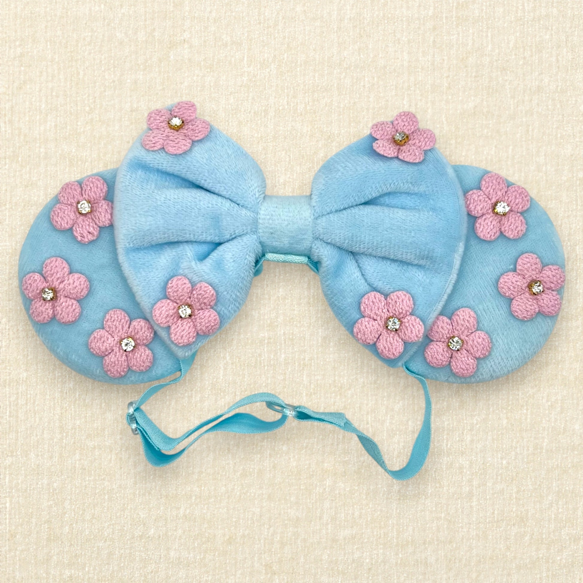 Blue velvet mouse ears and bow with pink fabric flowers on an elastic headband