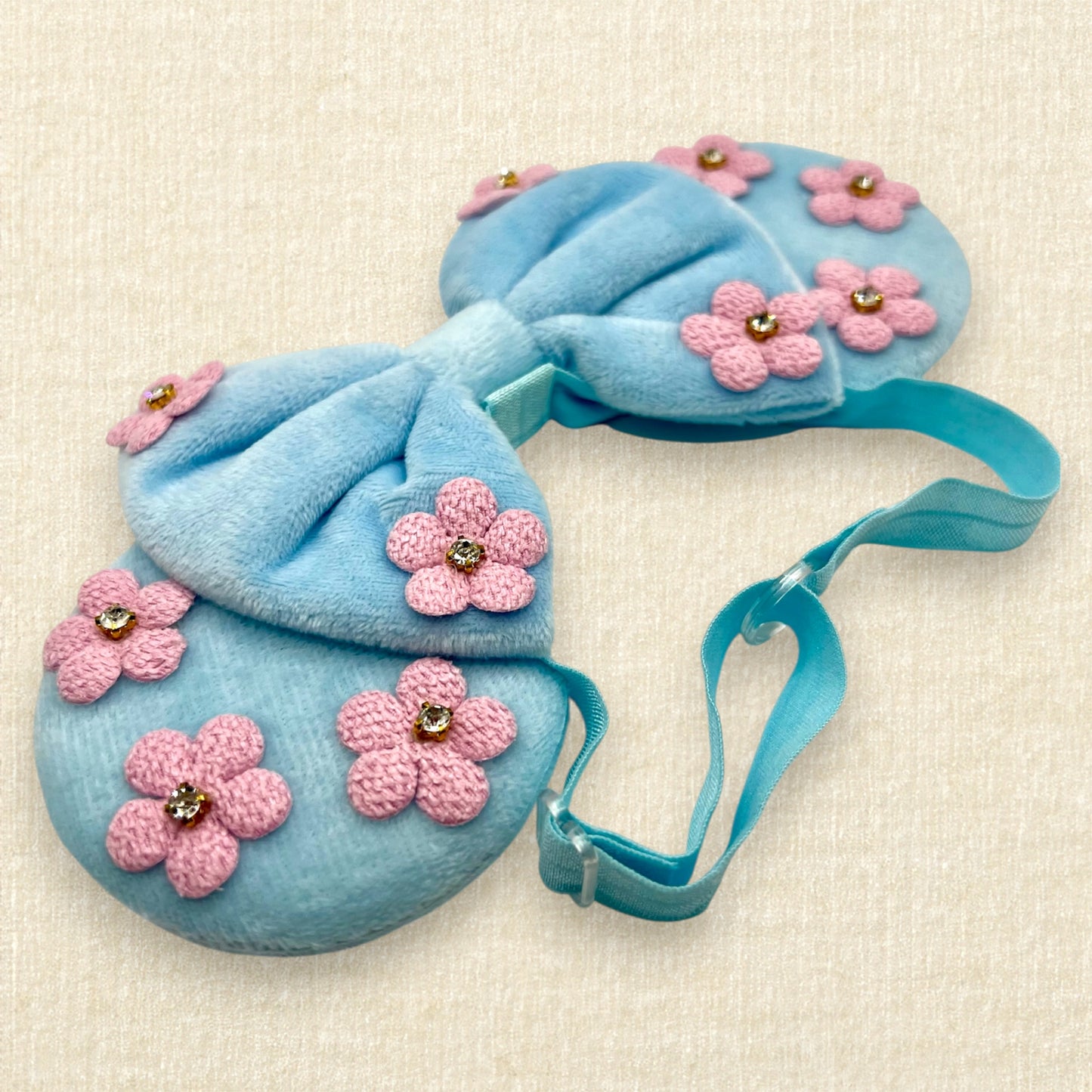Blue velvet mouse ears and bow with pink fabric flowers on an elastic headband