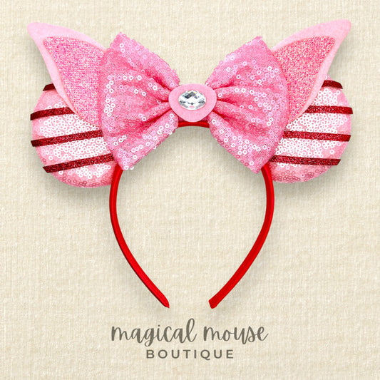Pink mouse ears headband with sequins on a beige background, labeled 'magical mouse boutique'.
