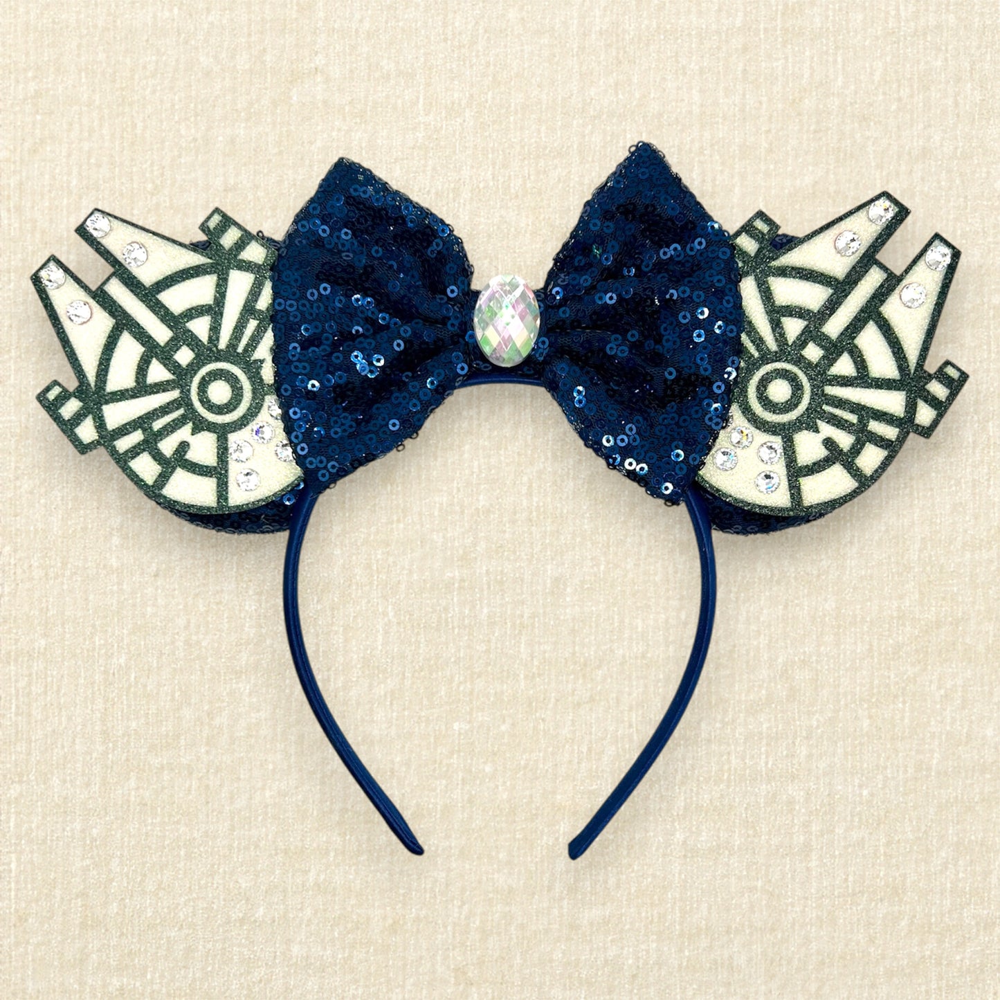 Navy blue sequin mouse ears with glitter space ships, navy blue bow, and rhinestones