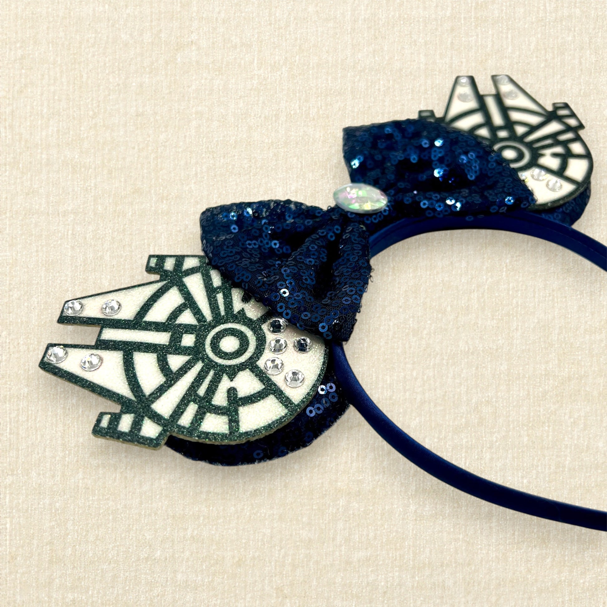 Navy blue sequin mouse ears with glitter space ships, navy blue bow, and rhinestones