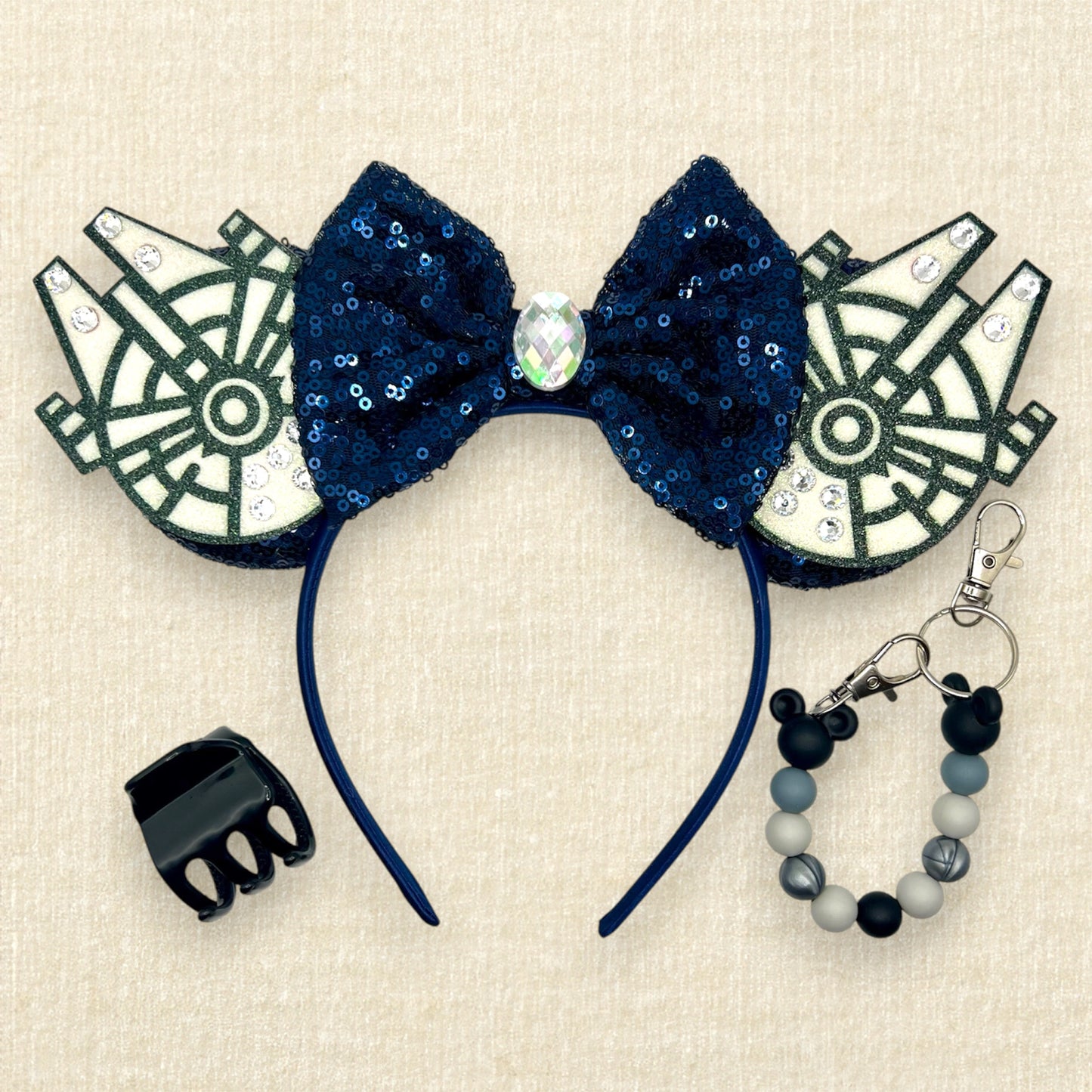 Navy blue sequin mouse ears with glitter space ships, navy blue bow, and rhinestones