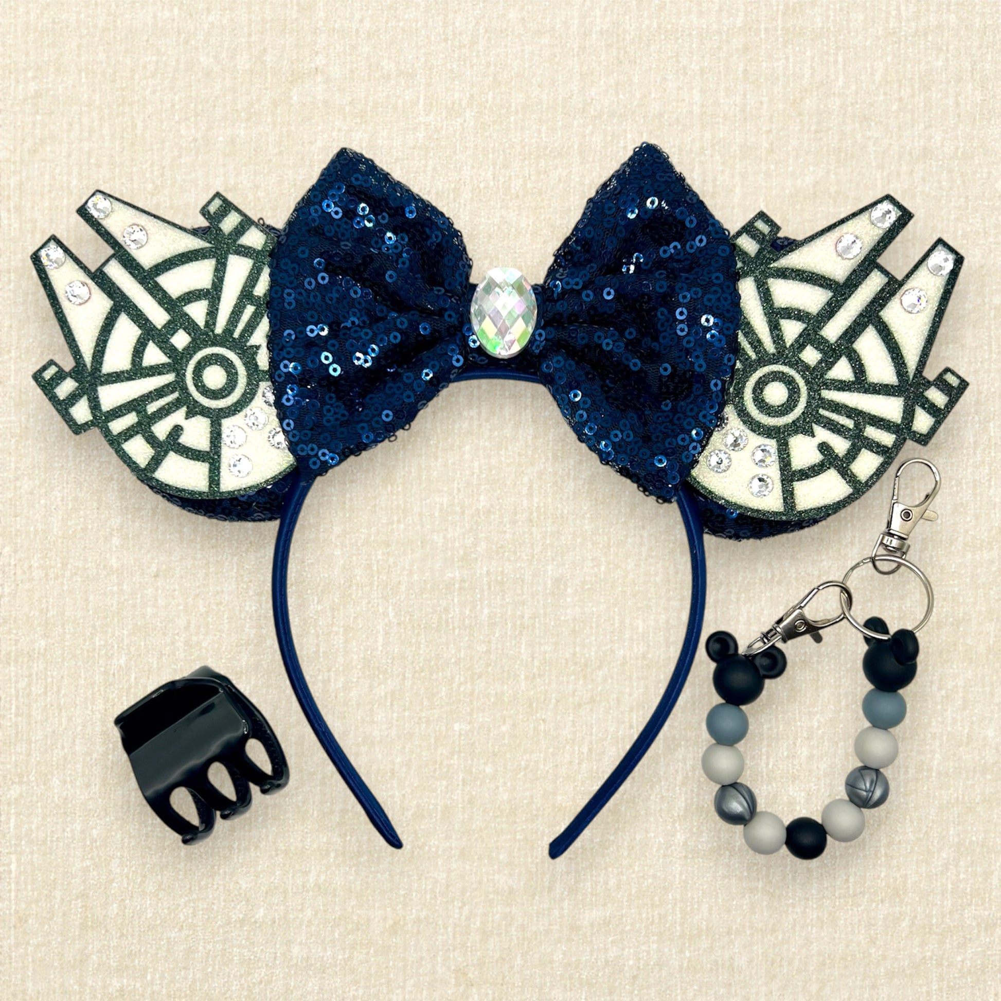 Navy blue sequin mouse ears with glitter space ships, navy blue bow, and rhinestones