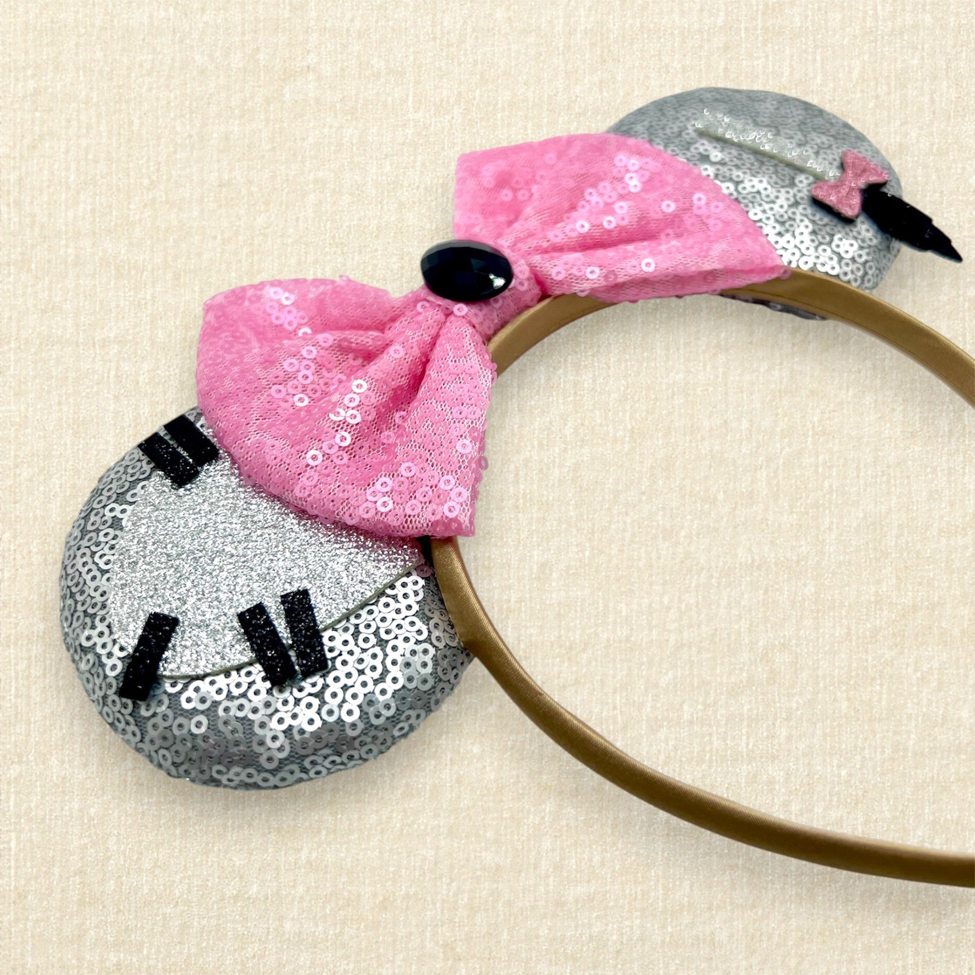 Gray sequin mouse ears headband with donkey-inspired silver glitter details and pink sequin bow