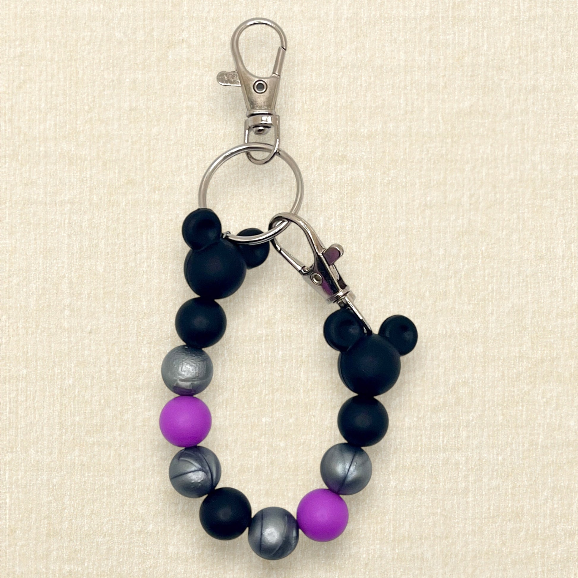 Purple, black, and silver beaded mouse ears holder keychain