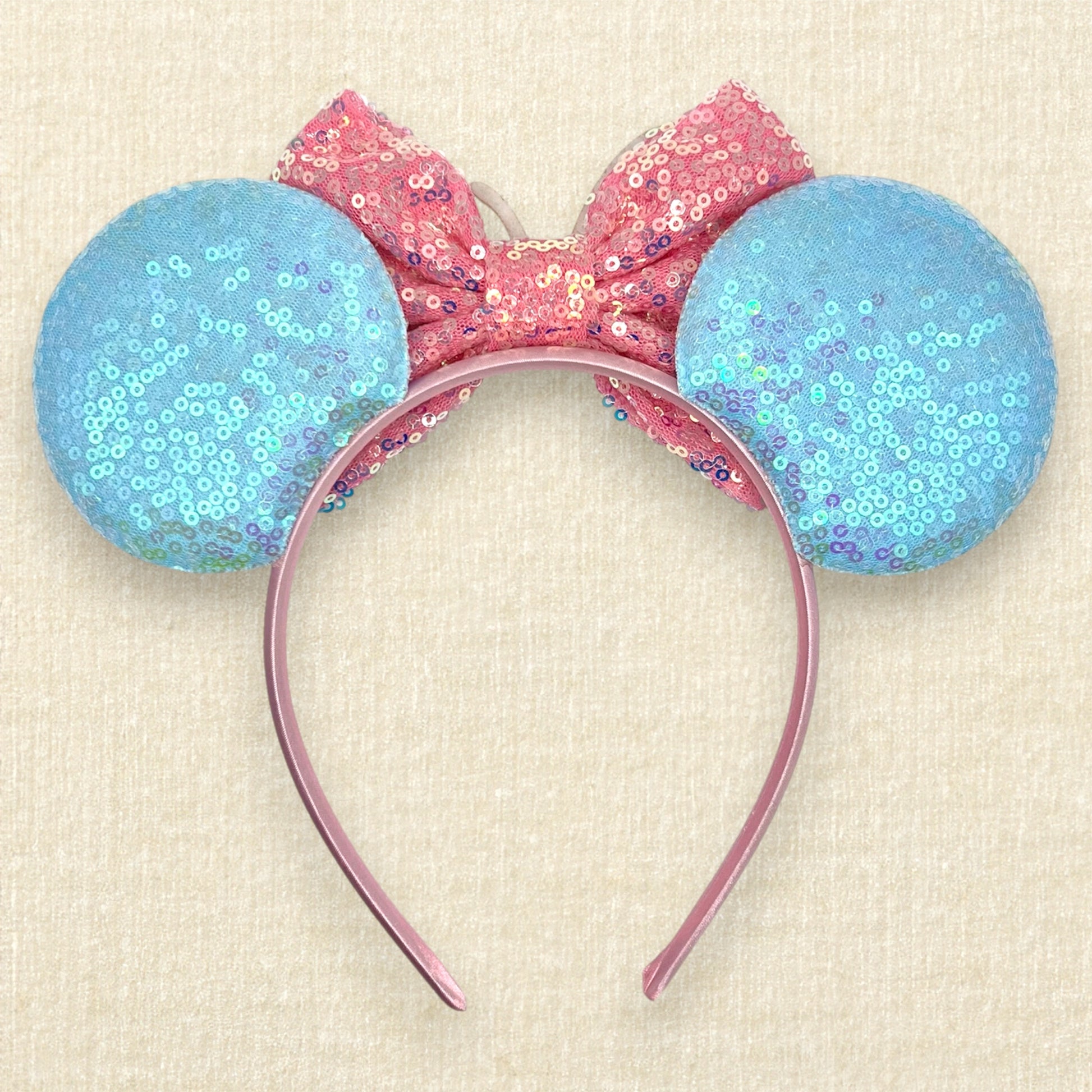 Colorful blue and pink ice cream-themed headband with sprinkles and cherry (back view)