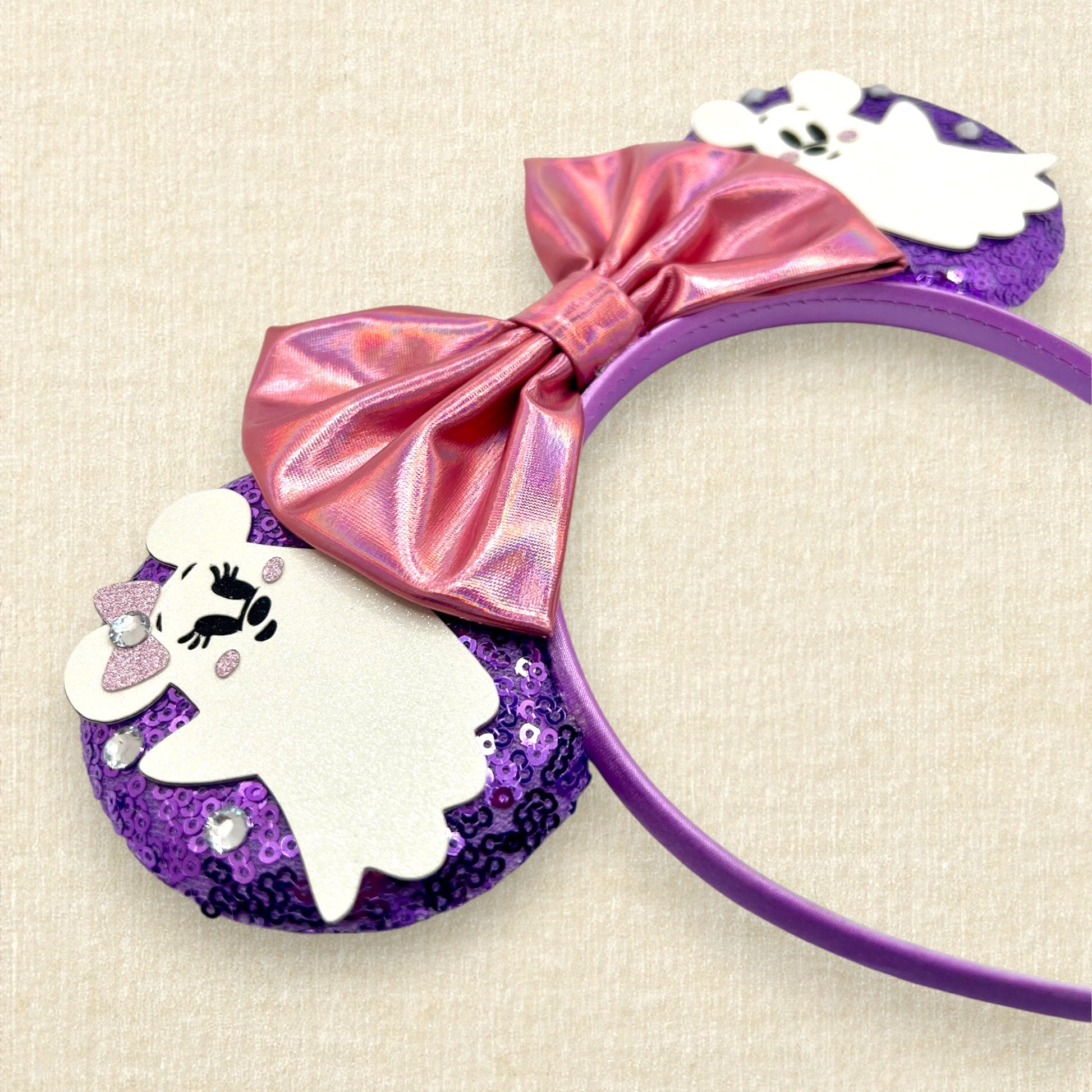 Purple sequin mouse ears with iridescent pink bow and Mickey and Minnie ghosts