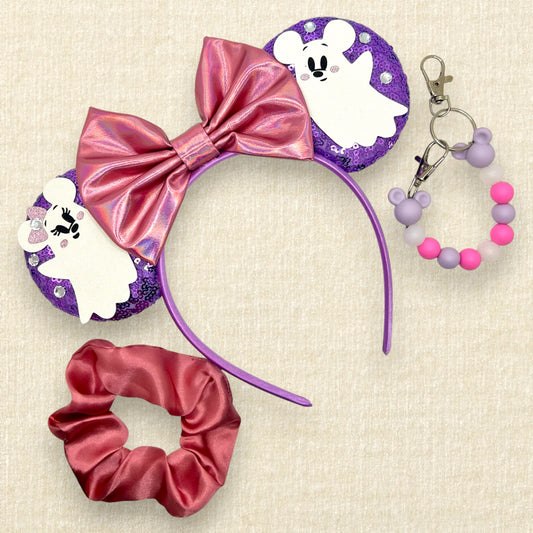 Purple sequin mouse ears with iridescent pink bow and Mickey and Minnie ghosts; pink scrunchie; purple and pink beaded mouse ears holder keychain