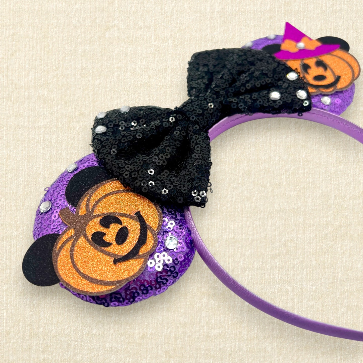 Purple sequin mouse ears with pumpkin Mickey and Minnie and black sequin bow