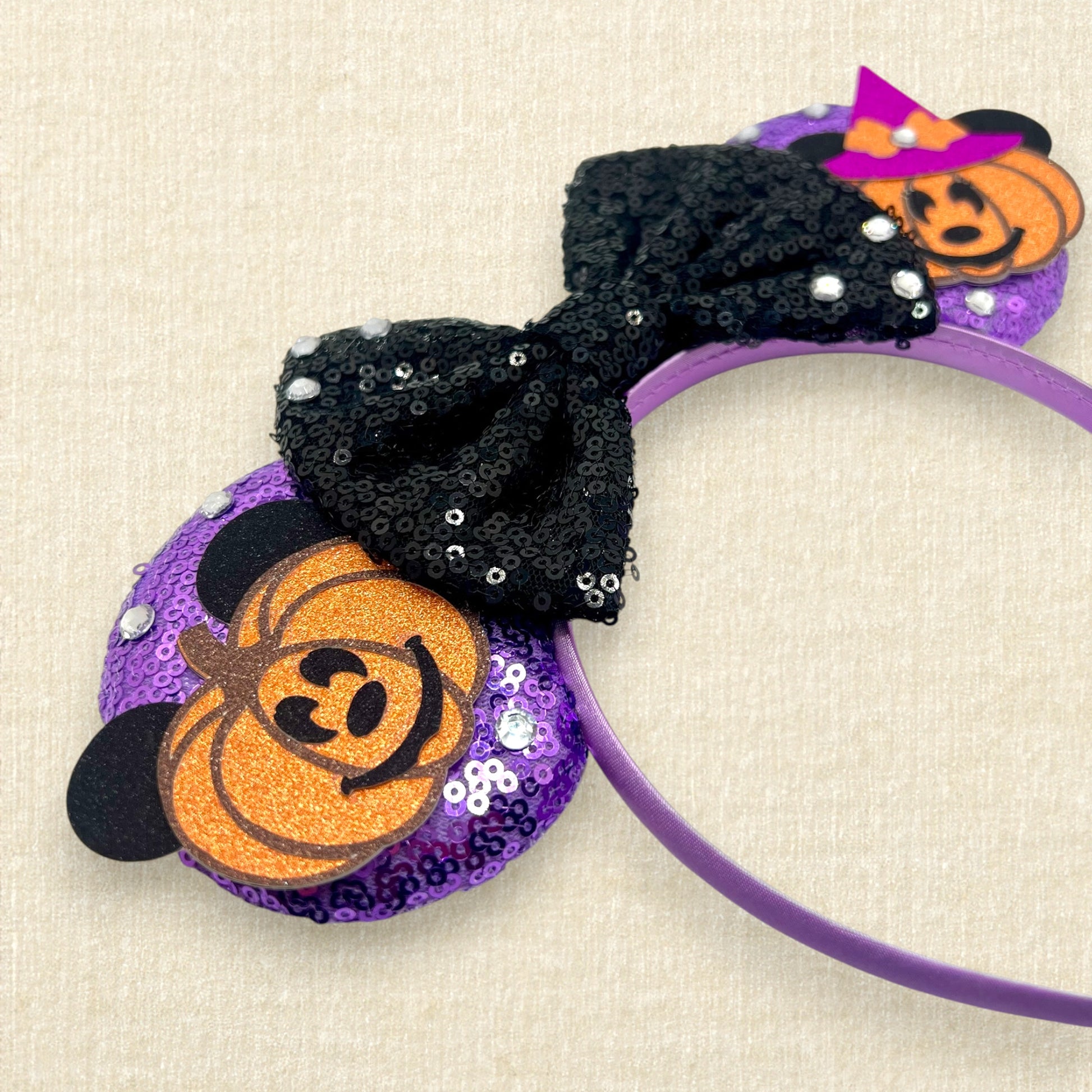 Purple sequin mouse ears with pumpkin Mickey and Minnie and black sequin bow