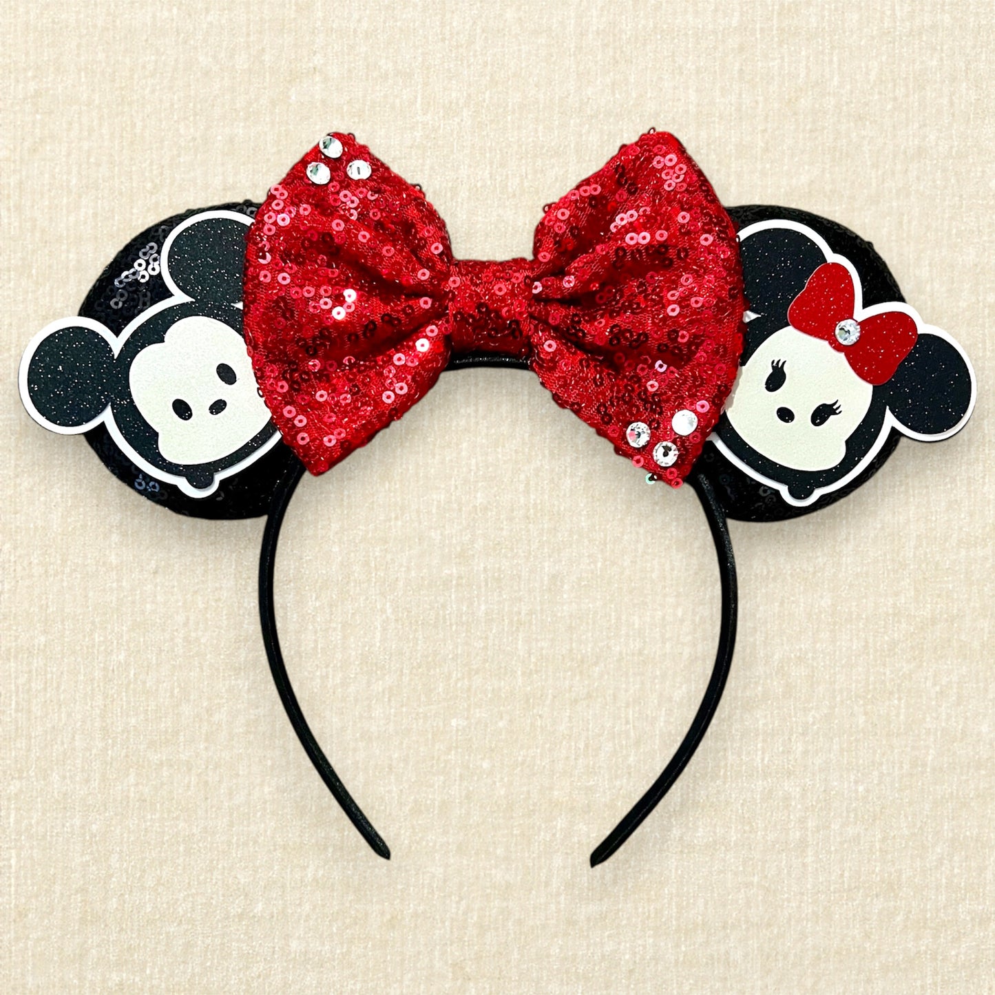 Black sequin mouse ears headband with red sequin bow and glitter mouse characters