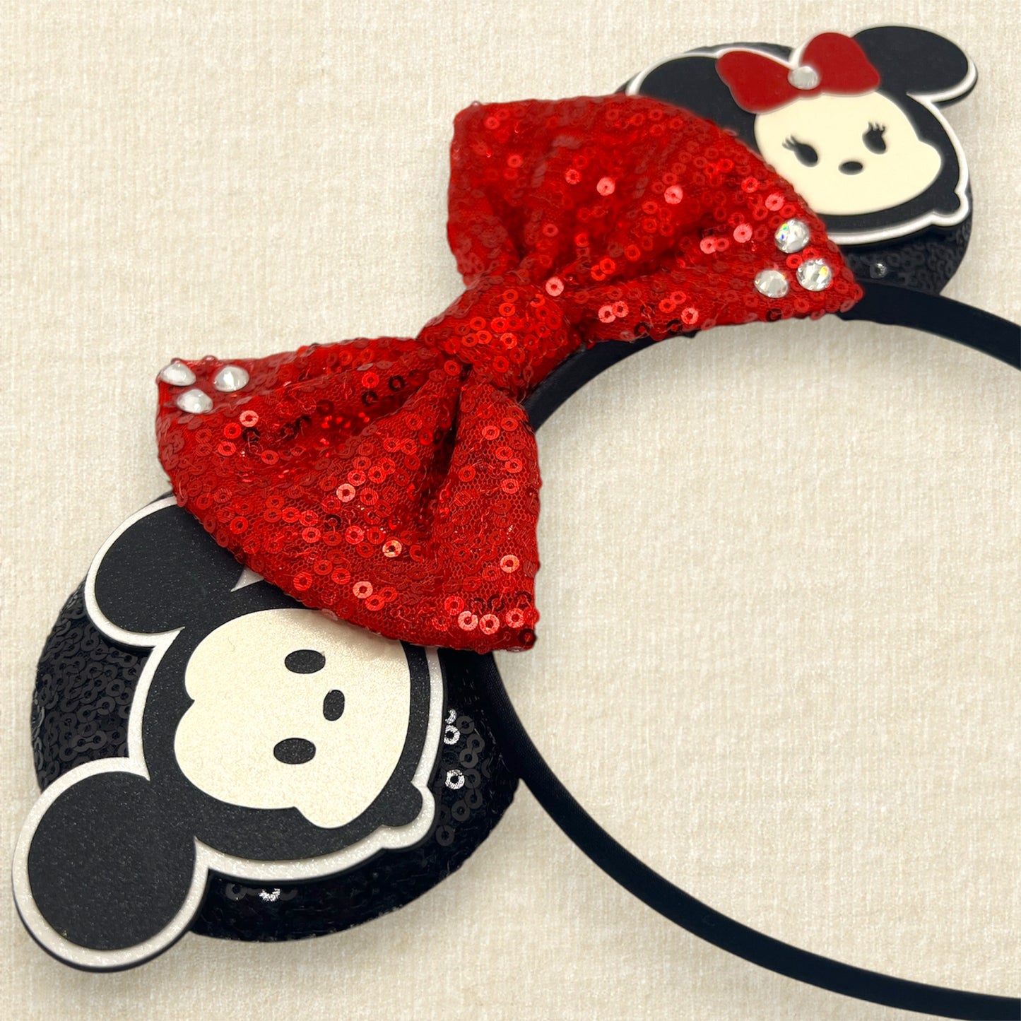 Black sequin mouse ears headband with red sequin bow and glitter mouse characters