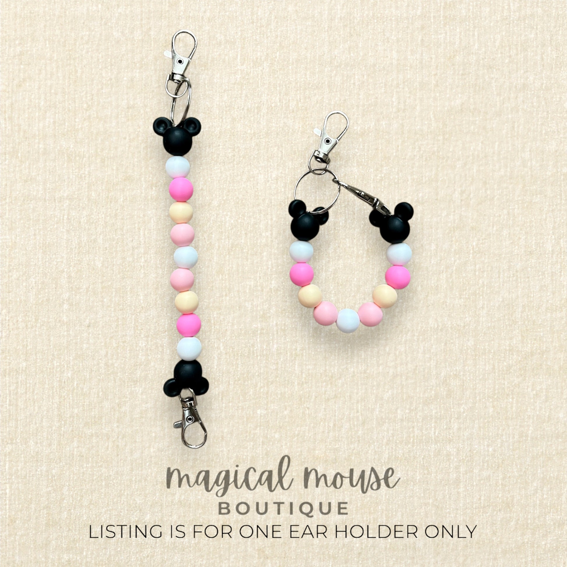 Minnie Mouse-themed lanyard and keychain with colorful beads on a beige background, branded 'magical mouse boutique'.