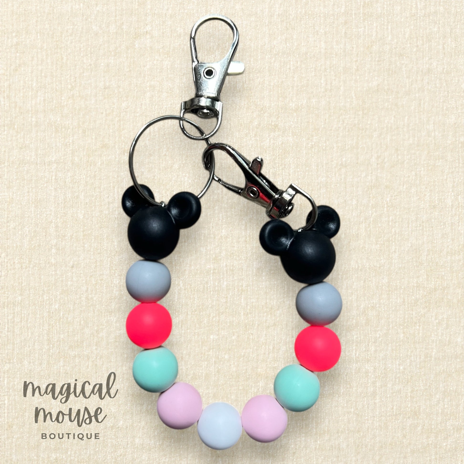 Colorful keychain with Mickey Mouse design on a beige background