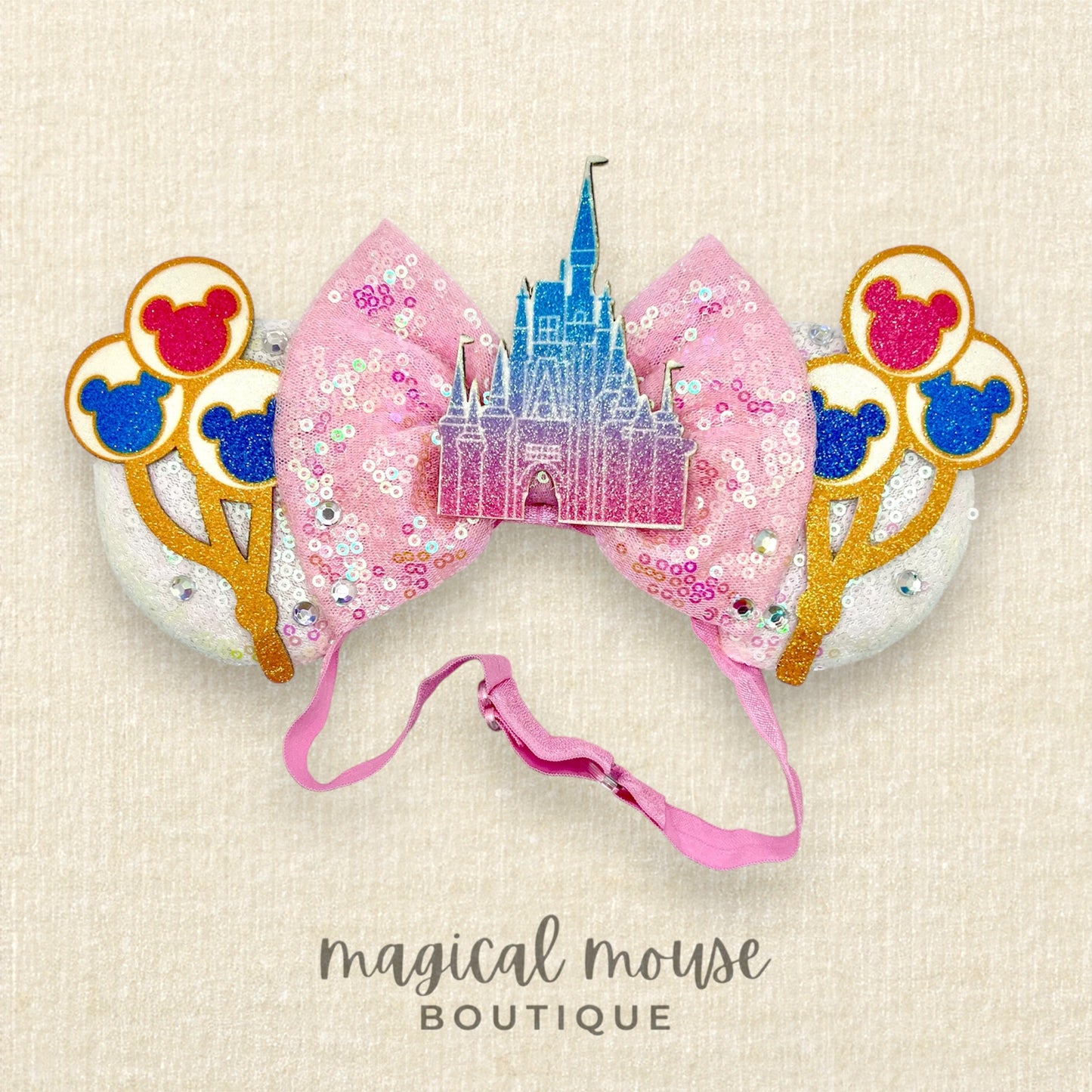 Decorative mouse ears with glitter balloons and castle design 
