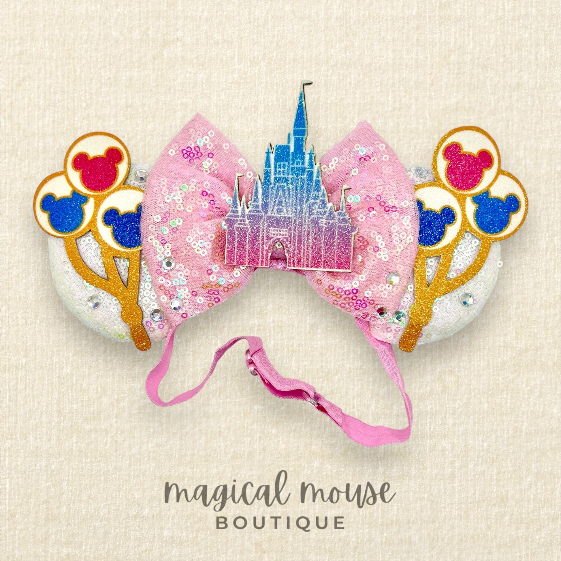 Decorative mouse ears with glitter balloons and castle design 