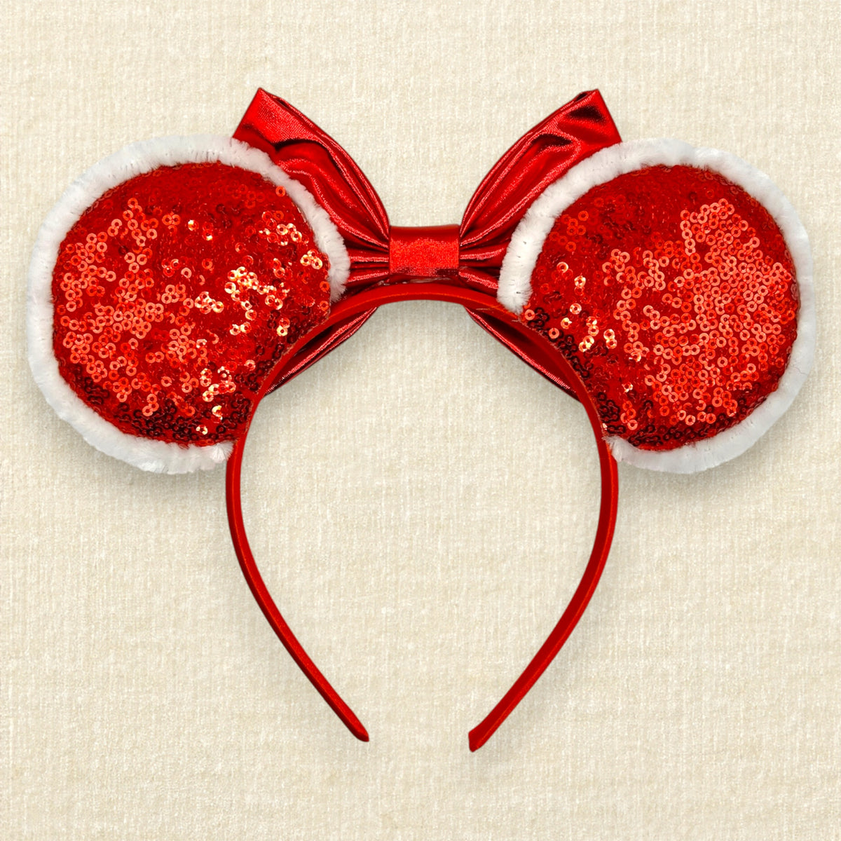 A festive red and white candy cane themed mouse ears headband with red sequin ears, white glitter peppermint swirls, fuzzy white trim, and a metallic red bow. (Back view)