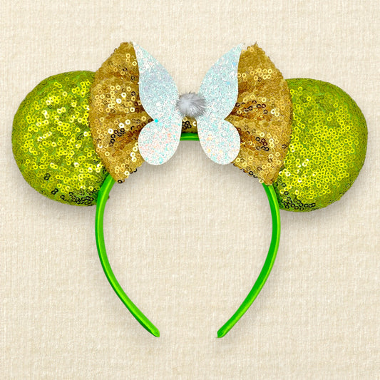 Light green sequin mouse ears headband with gold bow, glitter fairy wings, and pom-pom centerpiece