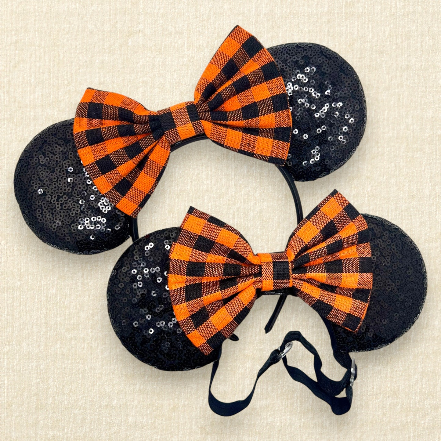 Matching mouse ears with black sequin ears and orange and black buffalo plaid bow