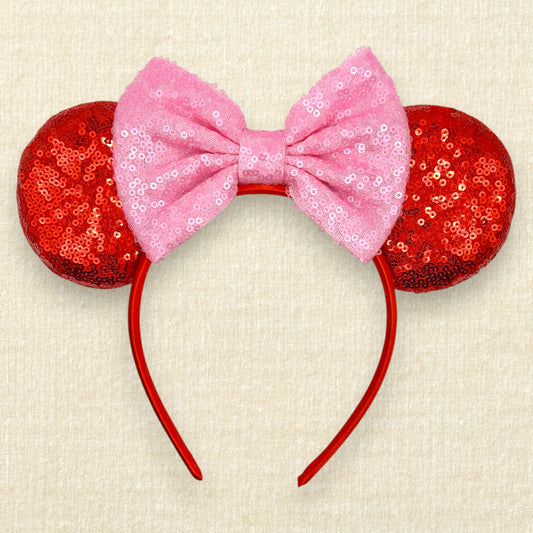 Red sequin mouse ears with a pink sequin bow