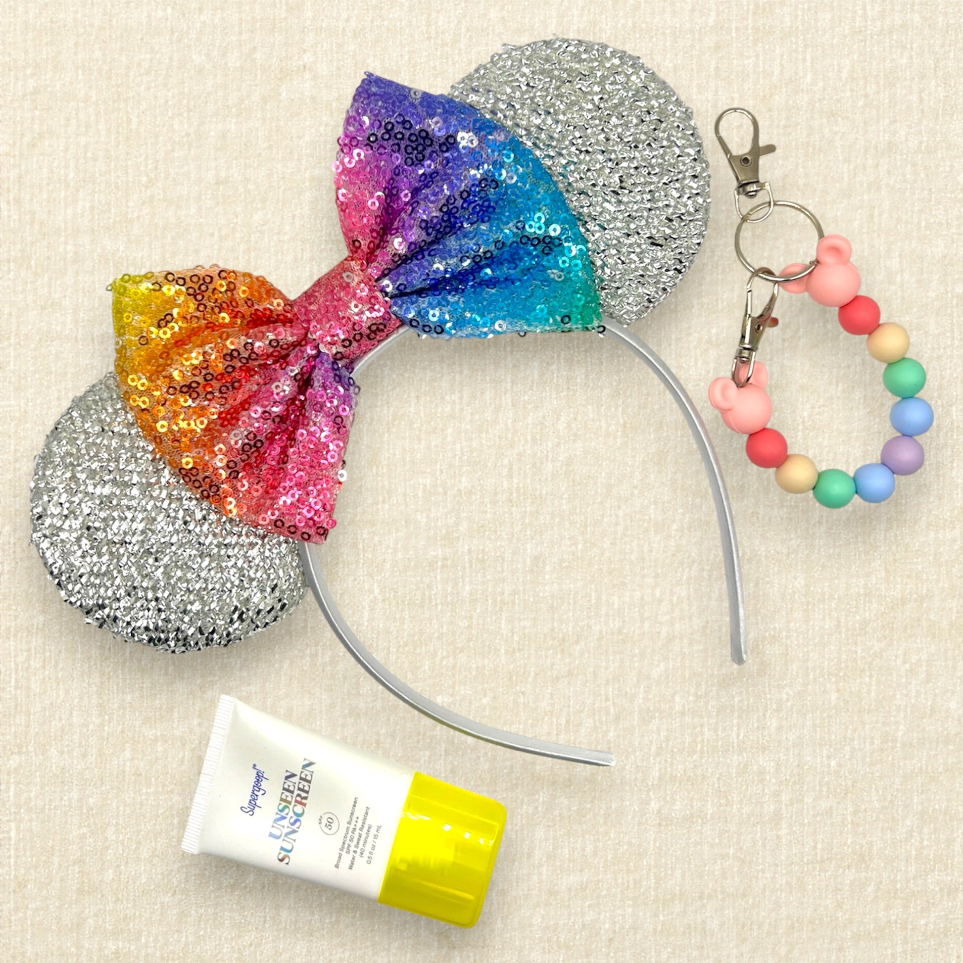 Silver mouse ears headband with rainbow sequin bow; sunscreen; colorful beaded mouse ears holder clip