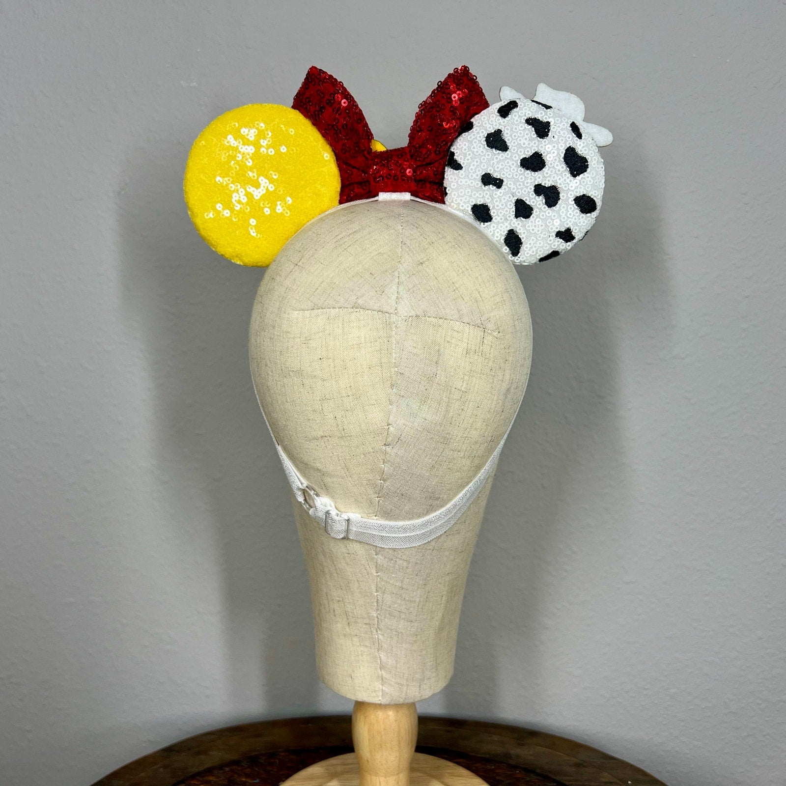 Colorful mouse ears headband with cowboy details on mannequin head
