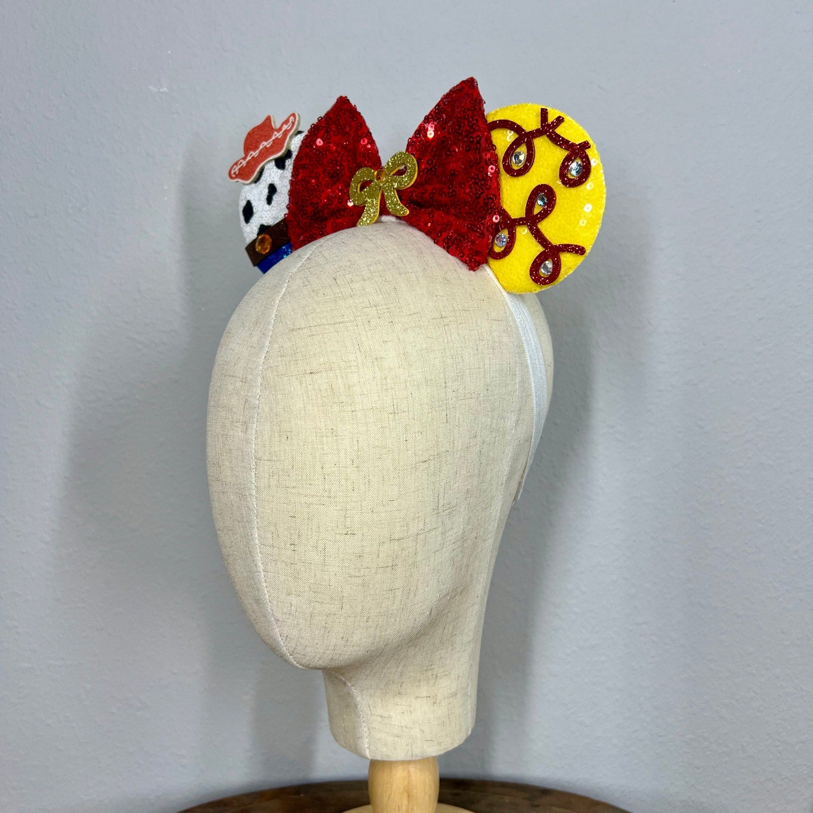 Colorful mouse ears headband with cowboy details on mannequin head